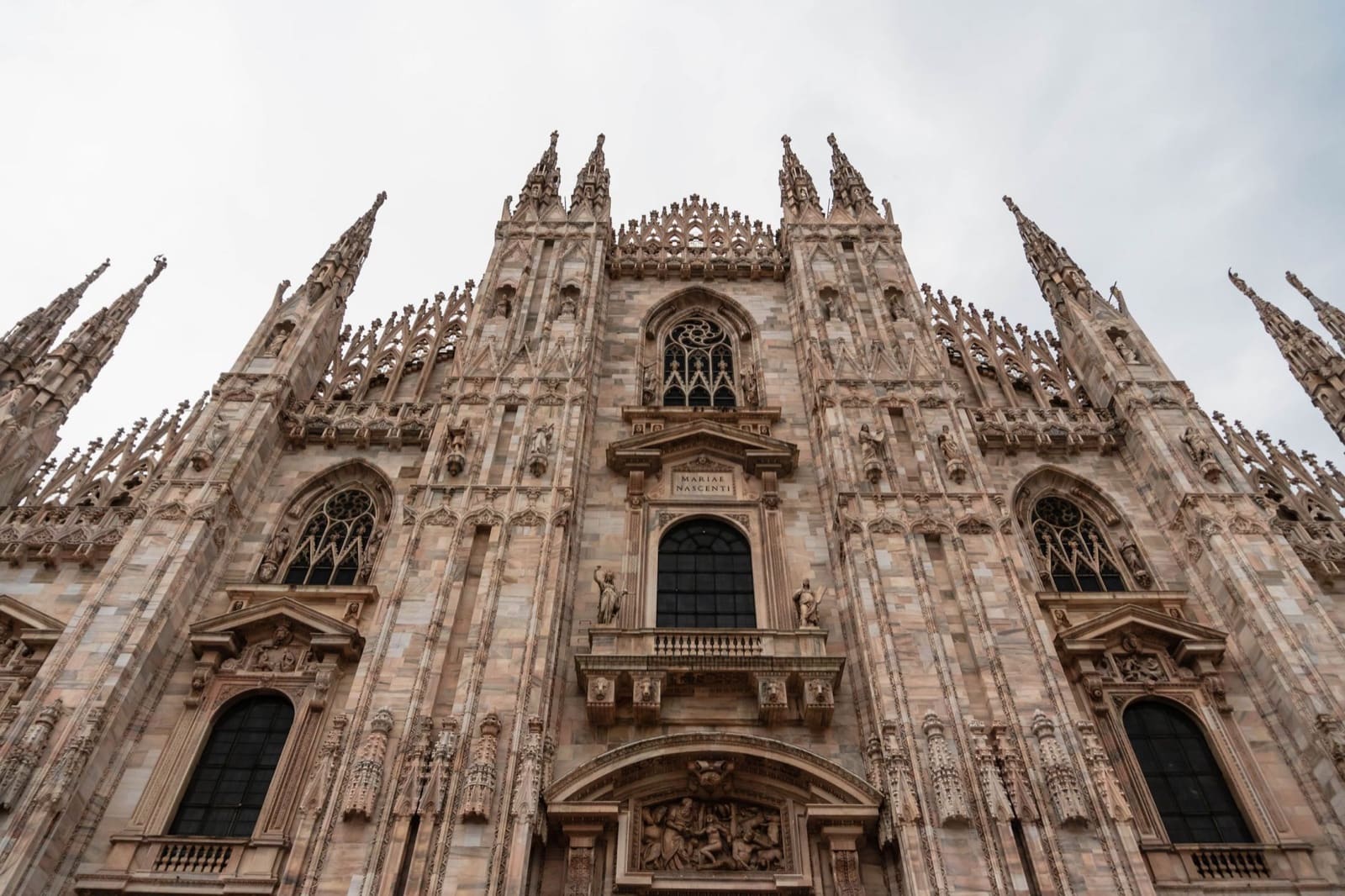 Stunning view of the intricate Gothic facade of Duomo di Milano in Italy.