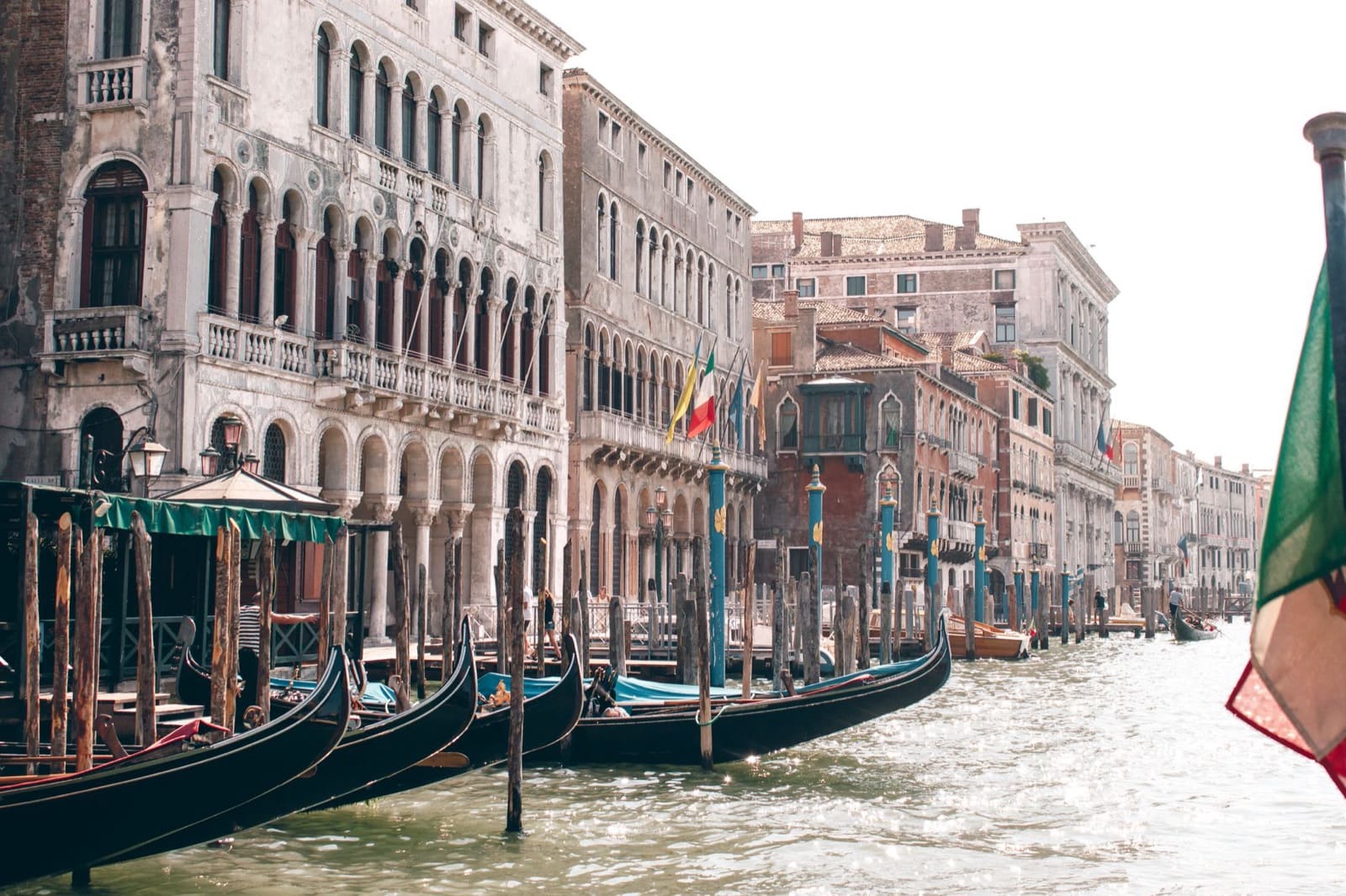 Scenic view of gondolas moored along the historic Grand Canal in Venice, Italy.